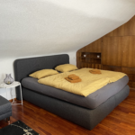 Schlafzimmer mit Schlafcouch des Apartments 2